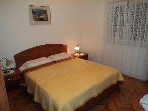 Postel nebo postele na pokoji v ubytování Apartments Racetin