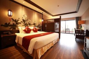 Postel nebo postele na pokoji v ubytování Lotus Aroma Sapa Hotel