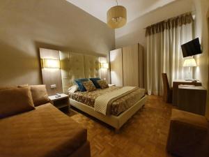 Postel nebo postele na pokoji v ubytování Hotel Continentale