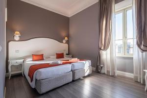 Posteľ alebo postele v izbe v ubytovaní Suite Castrense