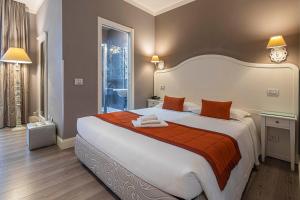 Posteľ alebo postele v izbe v ubytovaní Suite Castrense