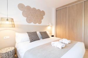 Postel nebo postele na pokoji v ubytování Calafell Home Apartments