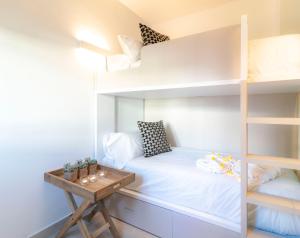 Postel nebo postele na pokoji v ubytování Calafell Home Apartments