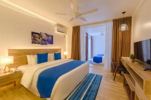 מיטה או מיטות בחדר ב-Dhiguveli Maldives