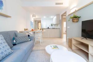 TV a/nebo společenská místnost v ubytování Calafell Home Apartments
