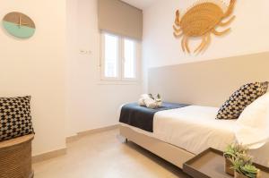 Postel nebo postele na pokoji v ubytování Calafell Home Apartments