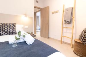 Postel nebo postele na pokoji v ubytování Calafell Home Apartments