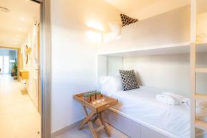 Postel nebo postele na pokoji v ubytování Calafell Home Apartments
