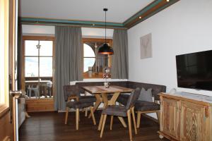 a dining room with a table and chairs at Landhaus Patricia in Ellmau
