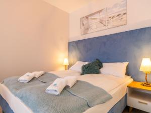 Posteľ alebo postele v izbe v ubytovaní ApartmentyPrzyMorzu Ogrody