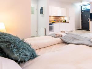 Posteľ alebo postele v izbe v ubytovaní ApartmentyPrzyMorzu Ogrody