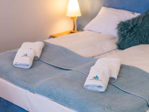 Posteľ alebo postele v izbe v ubytovaní ApartmentyPrzyMorzu Ogrody