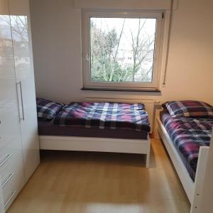 Ένα ή περισσότερα κρεβάτια σε δωμάτιο στο schöne 3 Zimmer Stadtwohnung