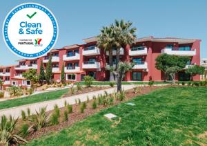 a building with a sign that reads clean and safe at Topazio Vibe Beach Hotel & Apartments - Adults Friendly in Albufeira
