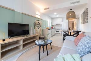 TV a/nebo společenská místnost v ubytování Calafell Home Apartments