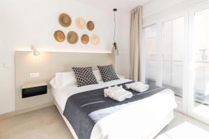 Postel nebo postele na pokoji v ubytování Calafell Home Apartments