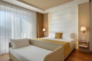 Postel nebo postele na pokoji v ubytování Hotel Concord