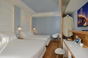 Postel nebo postele na pokoji v ubytování Hotel Concord