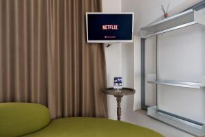 TV o dispositivi per l'intrattenimento presso Colosseum Jacuzzi Suites