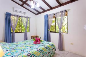 Ένα ή περισσότερα κρεβάτια σε δωμάτιο στο Bungalows Ache Cozy House