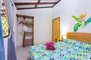 Ένα ή περισσότερα κρεβάτια σε δωμάτιο στο Bungalows Ache Cozy House
