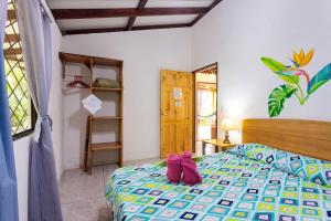 Ένα ή περισσότερα κρεβάτια σε δωμάτιο στο Bungalows Ache Cozy House