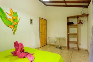 Ένα ή περισσότερα κρεβάτια σε δωμάτιο στο Bungalows Ache Cozy House