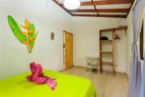 Ένα ή περισσότερα κρεβάτια σε δωμάτιο στο Bungalows Ache Cozy House