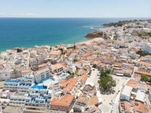 an aerial view of a city and the ocean at Bertolina Guest House in Albufeira