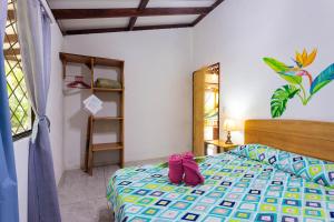 Ένα ή περισσότερα κρεβάτια σε δωμάτιο στο Bungalows Ache Cozy House