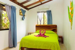 Ένα ή περισσότερα κρεβάτια σε δωμάτιο στο Bungalows Ache Cozy House