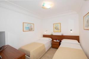 A bed or beds in a room at Il giardino dei limoni
