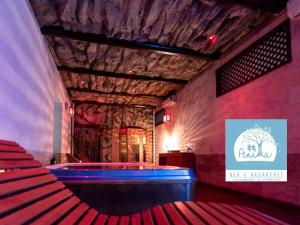 a stage with red seats and a sign on the wall at B&B Casa di Anita in Arnesano