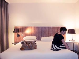 Postel nebo postele na pokoji v ubytování Mercure Hotel Nijmegen Centre
