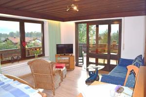 Posezení v ubytování Ferienwohnungen "Am Golfplatz" inkl. Chiemgaukarte