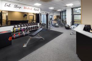 a gym with treadmills and exercise equipment at Crowne Plaza Glasgow, an IHG Hotel in Glasgow