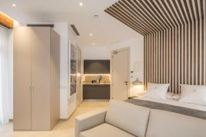 Mon Suites Benlliure客房内的一张或多张床位