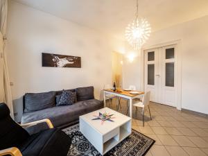 a living room with a couch and a table at Arbio I Cozy Apart in Leipzig center in Leipzig +16 photos