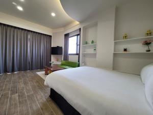 En eller flere senger på et rom på 渡小夜電梯民宿 Yilannight B&B
