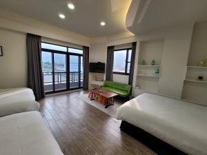 En eller flere senger på et rom på 渡小夜電梯民宿 Yilannight B&B