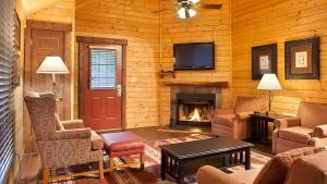 a living room with a fireplace and a tv at Bluegreen Vacations Shenandoah Crossing, Ascend Resort Collection in Gordonsville