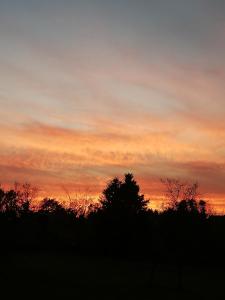 The sunrise or sunset as seen from a vendégházakat or nearby