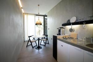 Kuchyň nebo kuchyňský kout v ubytování ecoSuites