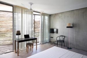 Postel nebo postele na pokoji v ubytování ecoSuites + 37 fotografií