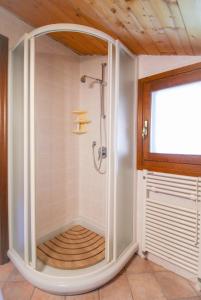 a shower with a glass door in a bathroom at Da Anna in Cremia
