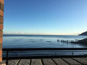 a view of a body of water with a pier at B2 Waterfoot Apartment in Newcastle