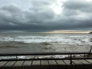 a view of the ocean on a cloudy day at B2 Waterfoot Apartment in Newcastle