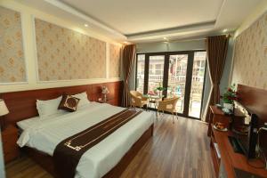 Postel nebo postele na pokoji v ubytování Sapa Unique Hotel + 37 fotografií