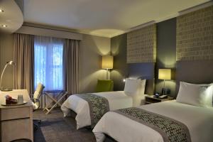 Holiday Inn Johannesburg OR Tambo Airport Hotel by IHG客房内的一张或多张床位