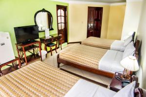 TV a/nebo společenská místnost v ubytování Hotel El Auca